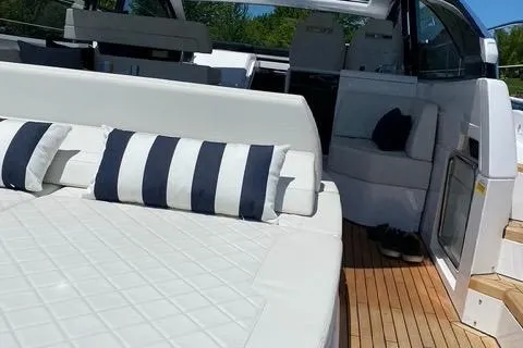 Slide: The Image of Fairline 45/43 Targa 2020 yacht interior with white seating and striped cushions. - 9