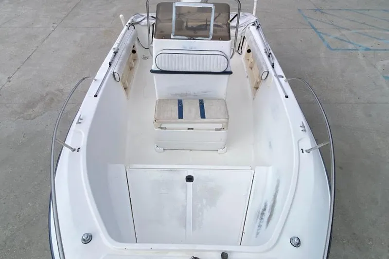 Slide: The Image of 2000 Seafox 21 CC boat interior with seating and console, viewed from above. - 10