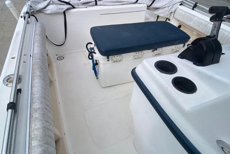 Slide: The Image of 2000 Seafox 21 CC boat interior with seating and control panel. - 17