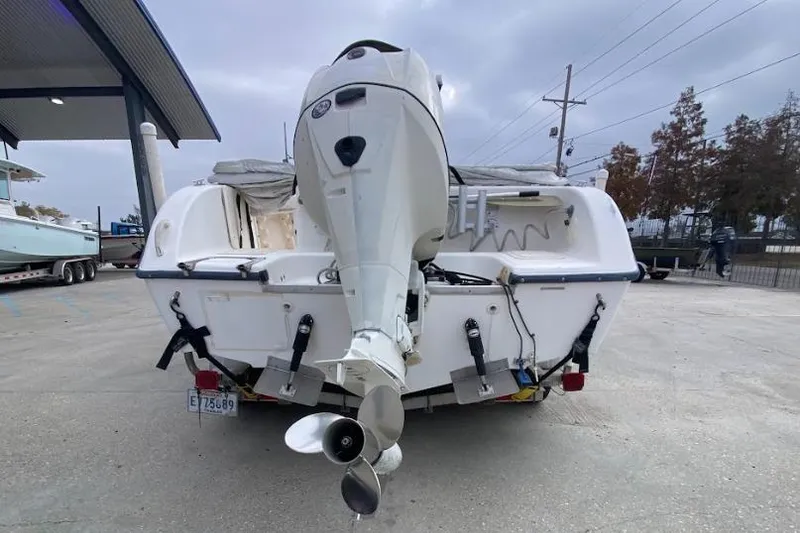 Slide: The Image of Rear view of a 2000 Seafox 21 CC boat with an outboard motor. - 4