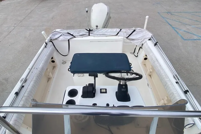 Slide: The Image of 2000 Seafox 21 CC boat interior with steering wheel and controls. - 9