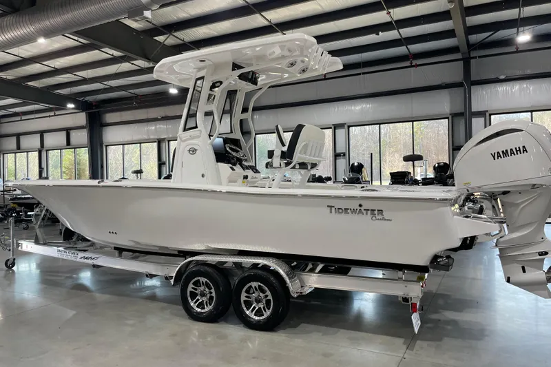 The Image of 2026 Tidewater 2500 Carolina Bay boat in showroom, featuring Yamaha engine. - 0