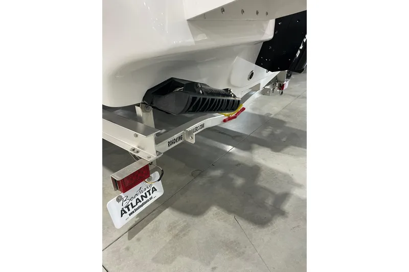 Slide: The Image of 2026 Tidewater 2500 Carolina Bay boat on trailer in showroom. - 2