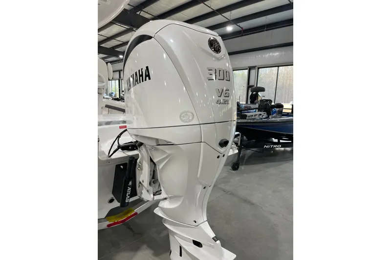 Slide: The Image of 2026 Tidewater 2500 Carolina Bay with Yamaha 300 V6 outboard engine in showroom. - 4