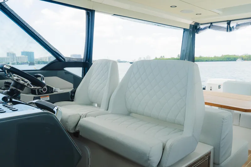 Slide: The Image of Interior of 2024 Saxdor 400 GTO yacht with luxurious seating and scenic water view. - 11