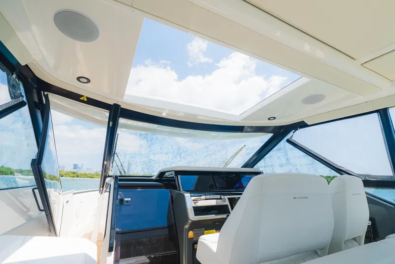 Slide: The Image of 2024 Saxdor 400 GTO helm with modern controls and panoramic windows. - 24