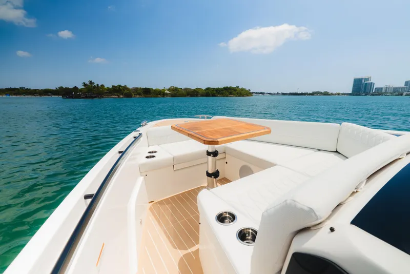 Slide: The Image of 2024 Saxdor 400 GTO boat with spacious white deck, under a clear blue sky. - 30