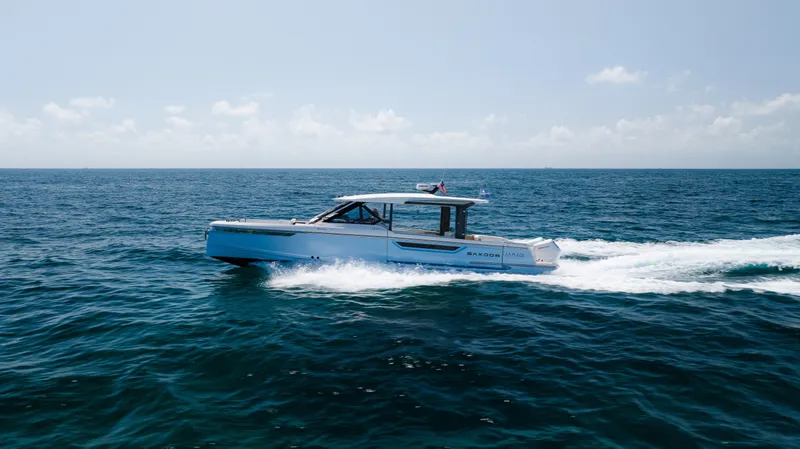 Slide: The Image of 2024 Saxdor 400 GTO cruising on open sea under clear sky. - 40