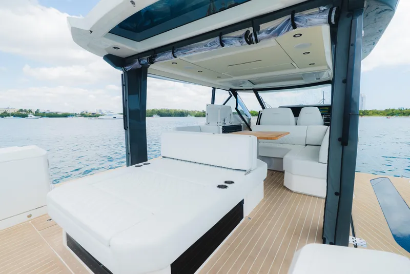 Slide: The Image of 2024 Saxdor 400 GTO luxury boat interior with spacious seating and scenic water view. - 9