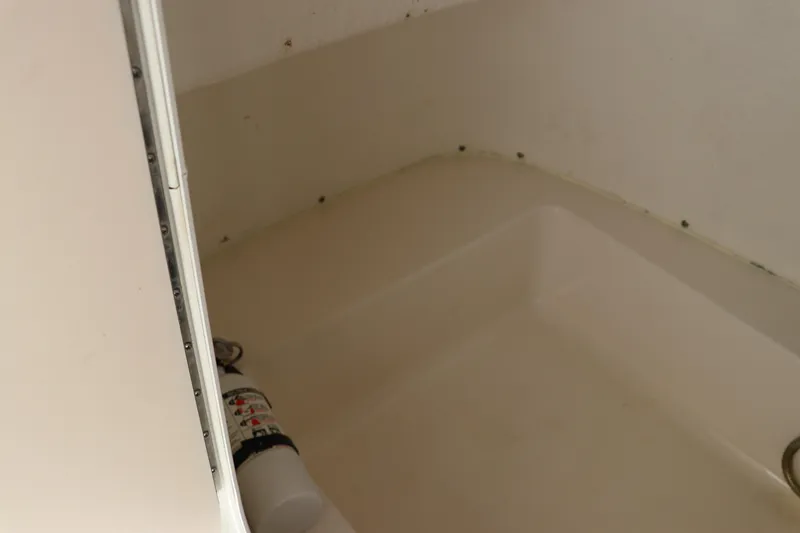 Slide: The Image of Control panel of a 2016 Tidewater 220 LXF boat with various switches and displays. - 18