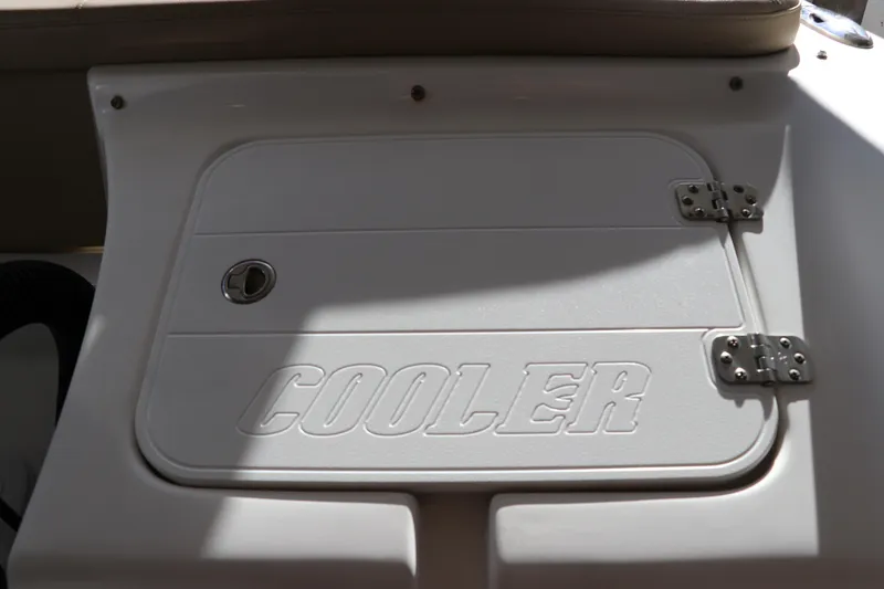 Slide: The Image of 2016 Tidewater 220 LXF boat with Yamaha outboard motor, parked outdoors. - 2