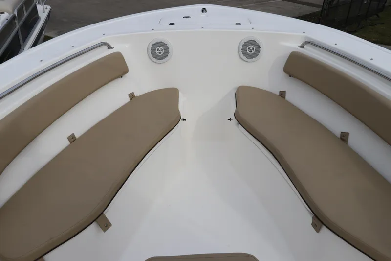 Slide: The Image of 2016 Tidewater 220 LXF boat interior with seating and storage compartment. - 21