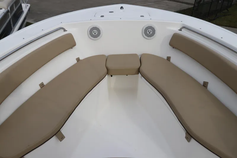 Slide: The Image of Interior compartment of 2016 Tidewater 220 LXF boat, featuring a drain and wiring. - 22