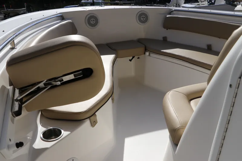 Slide: The Image of 2016 Tidewater 220 LXF boat interior with tan cushioned seating. - 25