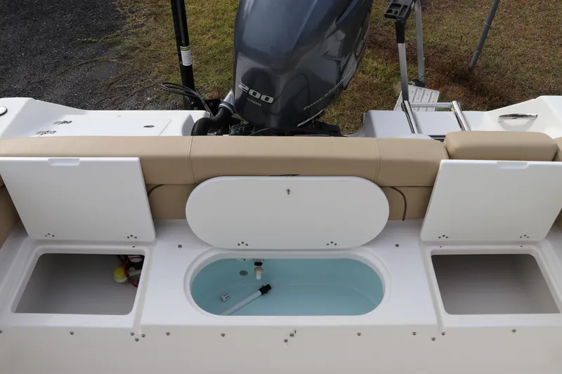 Slide: The Image of 2016 Tidewater 220 LXF boat with tan seating and Yamaha 200 engine. - 7