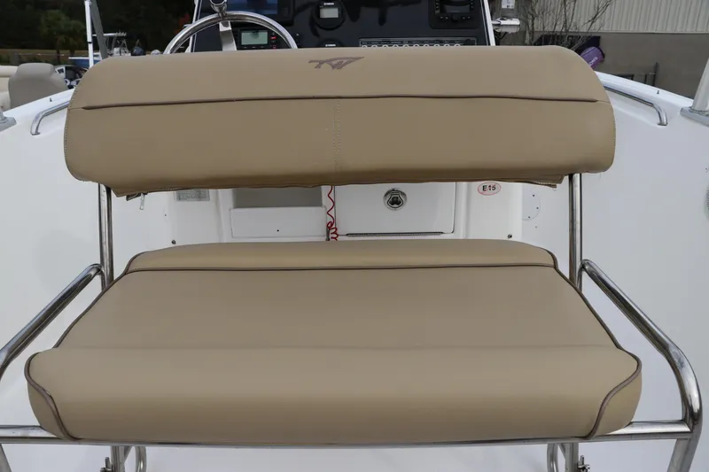 Slide: The Image of 2016 Tidewater 220 LXF boat with beige seating and powerful outboard motor. - 9