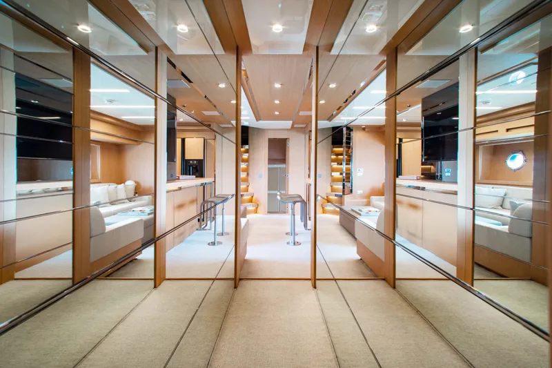 Slide: The Image of Luxurious interior of 2016 Riva 88' Florida yacht with mirrored walls and elegant design. - 13