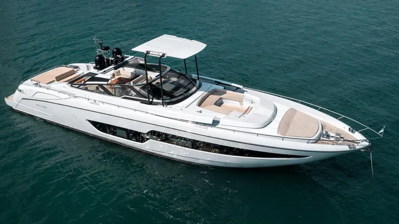 Slide: The Image of Luxury 2016 Riva 88' Florida yacht cruising on open water. - 2