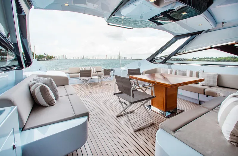 Slide: The Image of Luxurious 2016 Riva 88' Florida yacht deck with elegant seating and ocean view. - 22