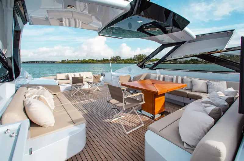 Slide: The Image of Luxurious 2016 Riva 88' Florida yacht deck with elegant seating and ocean view. - 29