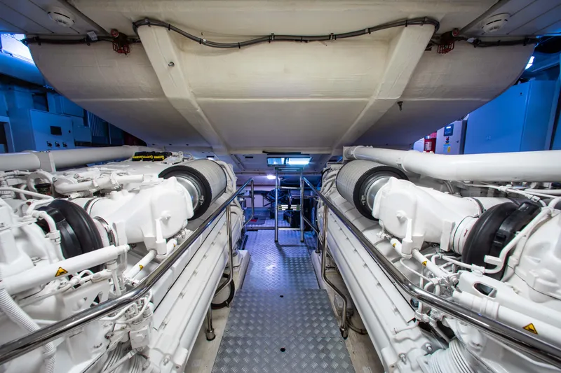 Slide: The Image of Engine room of 2016 Riva 88' Florida yacht, showcasing dual engines and mechanical components. - 32