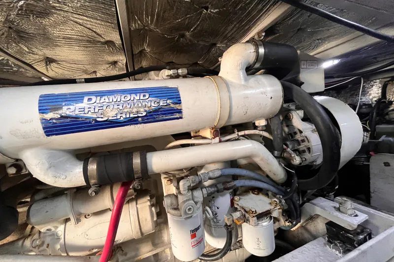 Slide: The Image of Engine of 2001 Silverton 42C yacht, featuring Diamond Performance Series components. - 100