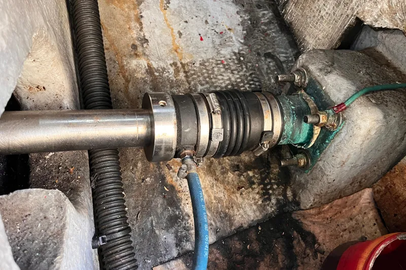 Slide: The Image of Boat shaft assembly in a 2001 Silverton 42C, showing metal and rubber components. - 110