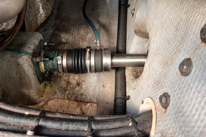 Slide: The Image of Engine compartment of a 2001 Silverton 42C boat, showing mechanical components and fittings. - 111