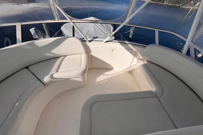 Slide: The Image of 2001 Silverton 42C yacht interior with white seating and scenic water view. - 12