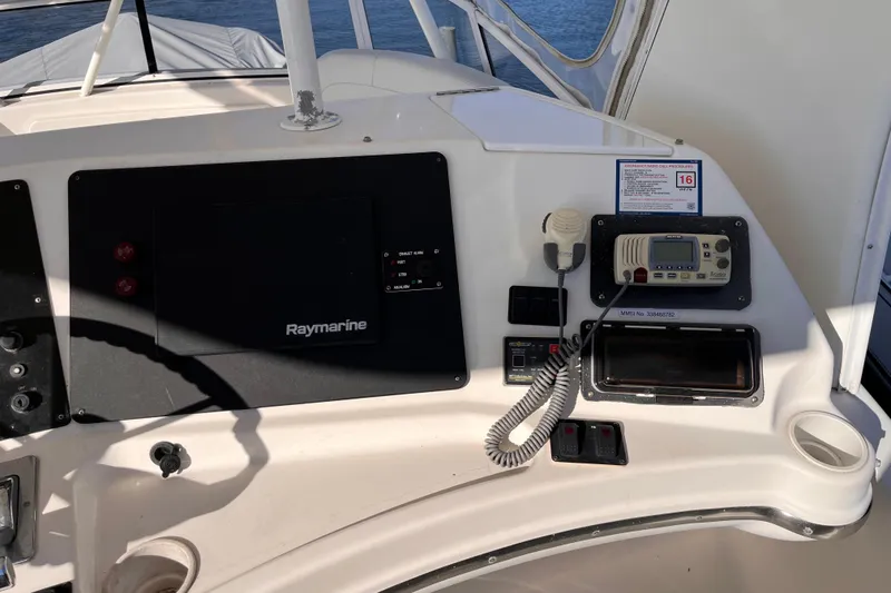 Slide: The Image of Control panel of a 2001 Silverton 42C boat with Raymarine equipment. - 15