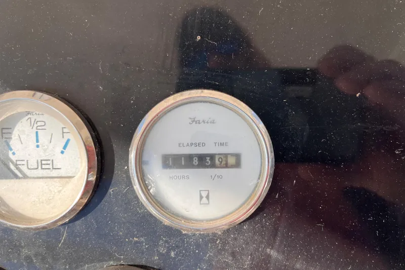 Slide: The Image of Close-up of Silverton 42C 2001 boat gauges showing fuel level and elapsed time. - 21