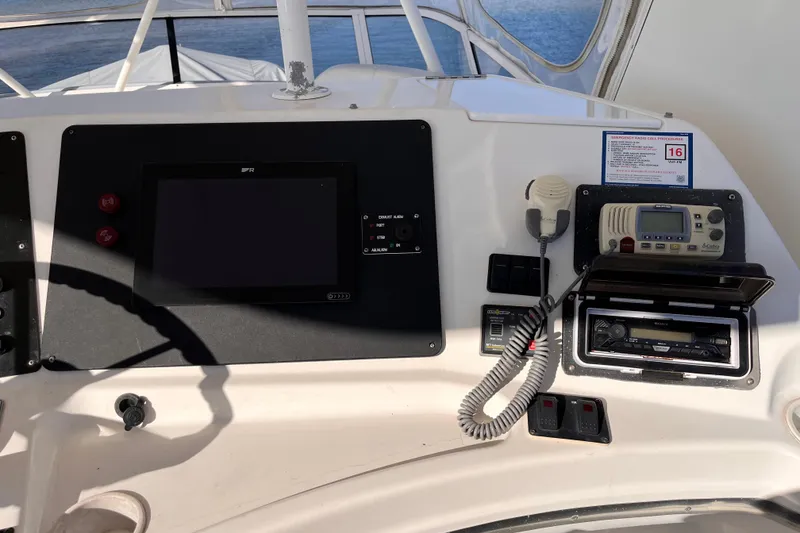 Slide: The Image of 2001 Silverton 42C boat dashboard with navigation and communication equipment. - 22