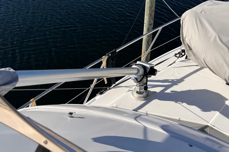 Slide: The Image of 2001 Silverton 42C yacht deck with railing and covered equipment. - 35