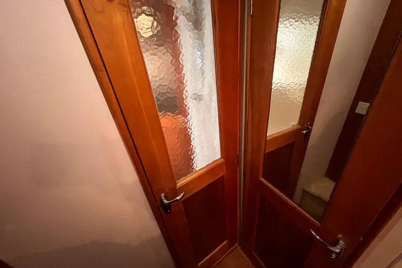 Slide: The Image of Wooden interior doors with frosted glass on a 2001 Silverton 42C yacht. - 75