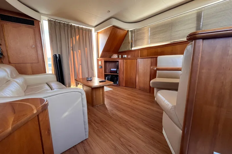 Slide: The Image of Luxurious interior of a 2001 Silverton 42C yacht with elegant wood finishes. - 80