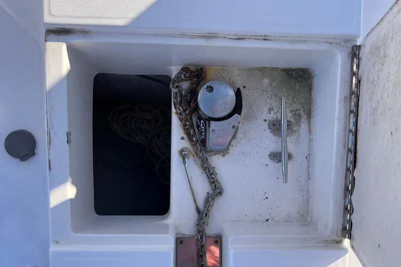Slide: The Image of Anchor locker of 2001 Silverton 42C boat with chain and winch. - 89