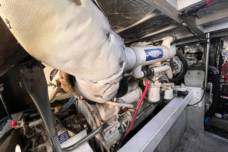 Slide: The Image of Engine compartment of a 2001 Silverton 42C boat, showcasing mechanical components. - 94