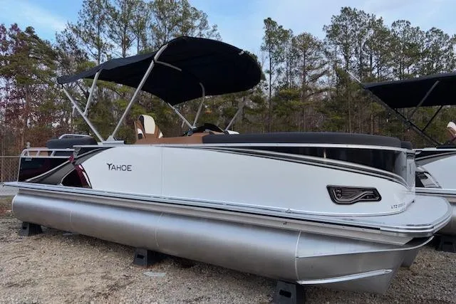 The Image of 2026 Tahoe Pontoon LTZ 2385 EL Tritoon with canopy, parked outdoors. - 1