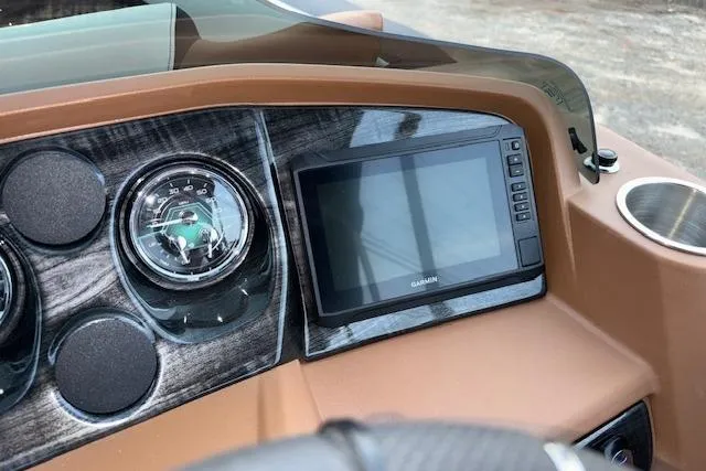 Slide: The Image of Dashboard of 2026 Tahoe Pontoon LTZ 2385 EL Tritoon with Garmin display. - 17