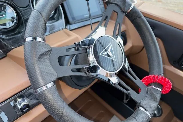 Slide: The Image of Steering wheel of 2026 Tahoe Pontoon LTZ 2385 EL Tritoon with modern dashboard design. - 19