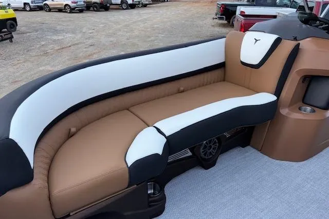 Slide: The Image of Luxurious seating on 2026 Tahoe Pontoon LTZ 2385 EL Tritoon boat, featuring tan and white upholstery. - 21