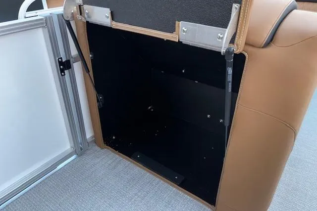 Slide: The Image of Open storage compartment in 2026 Tahoe Pontoon LTZ 2385 EL Tritoon boat. - 29