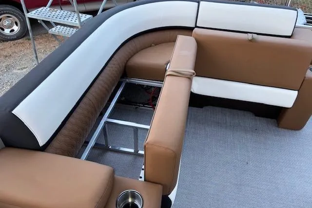 Slide: The Image of 2026 Tahoe Pontoon LTZ 2385 EL Tritoon with brown and white seating, showcasing interior design. - 31