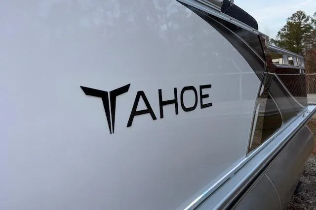 Slide: The Image of 2026 Tahoe Pontoon LTZ 2385 EL Tritoon, sleek design with logo detail. - 5