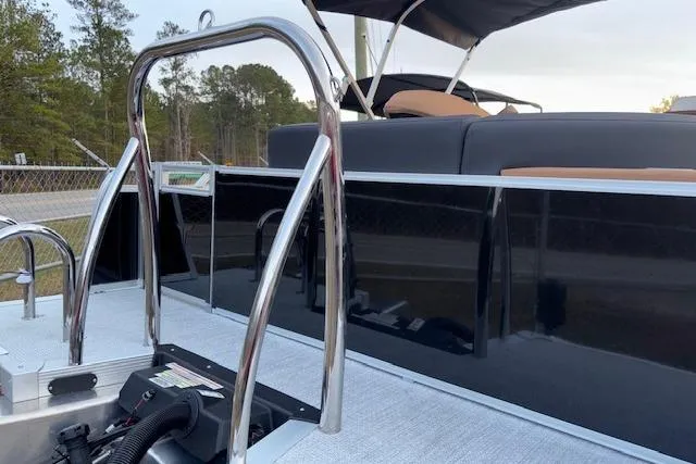 Slide: The Image of 2026 Tahoe Pontoon LTZ 2385 EL Tritoon with sleek design and stainless steel railings. - 8