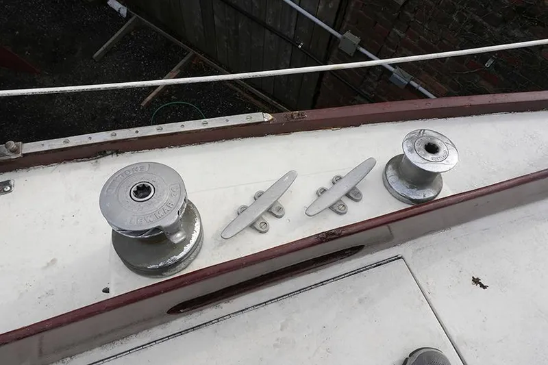 Slide: The Image of 1978 Bristol 29.9 sailboat deck with winches and cleats. - 23