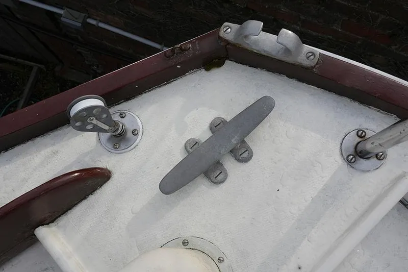 Slide: The Image of 1978 Bristol 29.9 boat deck with cleat and fittings, showcasing nautical hardware. - 24