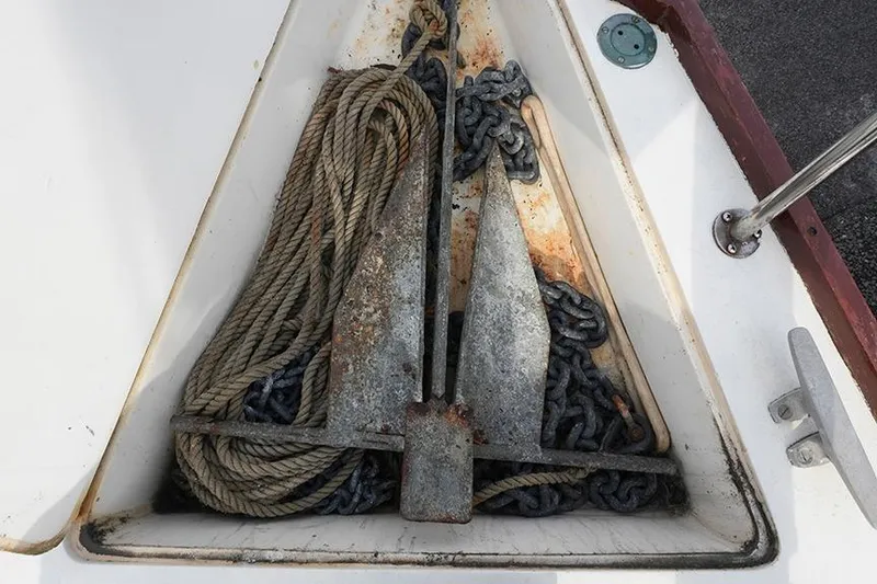 Slide: The Image of Anchor and ropes in a 1978 Bristol 29.9 sailboat's storage compartment. - 26