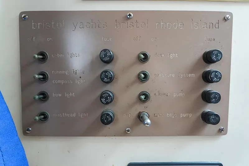 Slide: The Image of Control panel of a 1978 Bristol 29.9 yacht, featuring switches and fuses. - 36