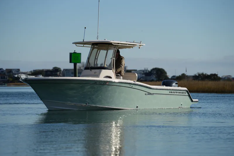 Slide: The Image of 2018 Grady-White Fisherman 236 boat on calm water, scenic background. - 10
